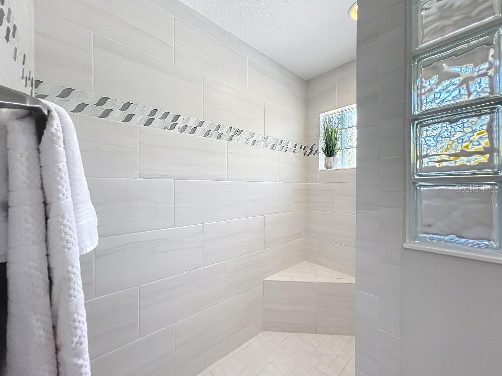 3191 Warbler Loop The Villages, FL 32163 - Photo 22 of 42 a bathroom with a shower