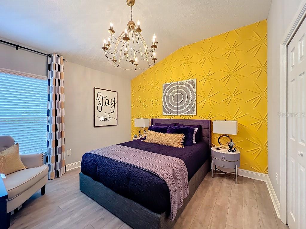 3191 Warbler Loop The Villages, FL 32163 - Photo 26 of 42 a bedroom with a bed and a couch