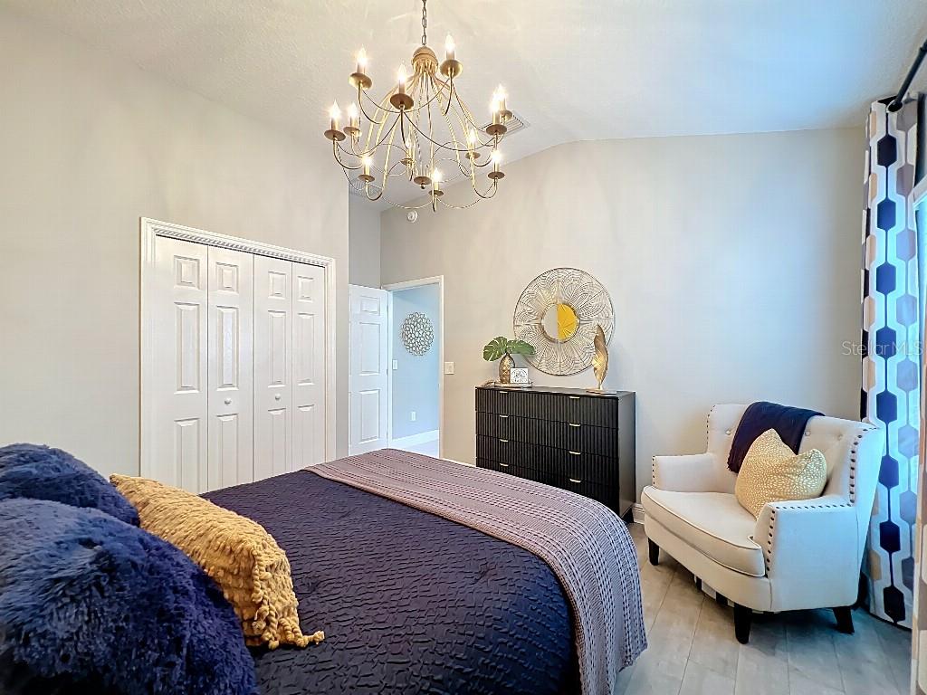 3191 Warbler Loop The Villages, FL 32163 - Photo 28 of 42 a bedroom with a bed and furniture