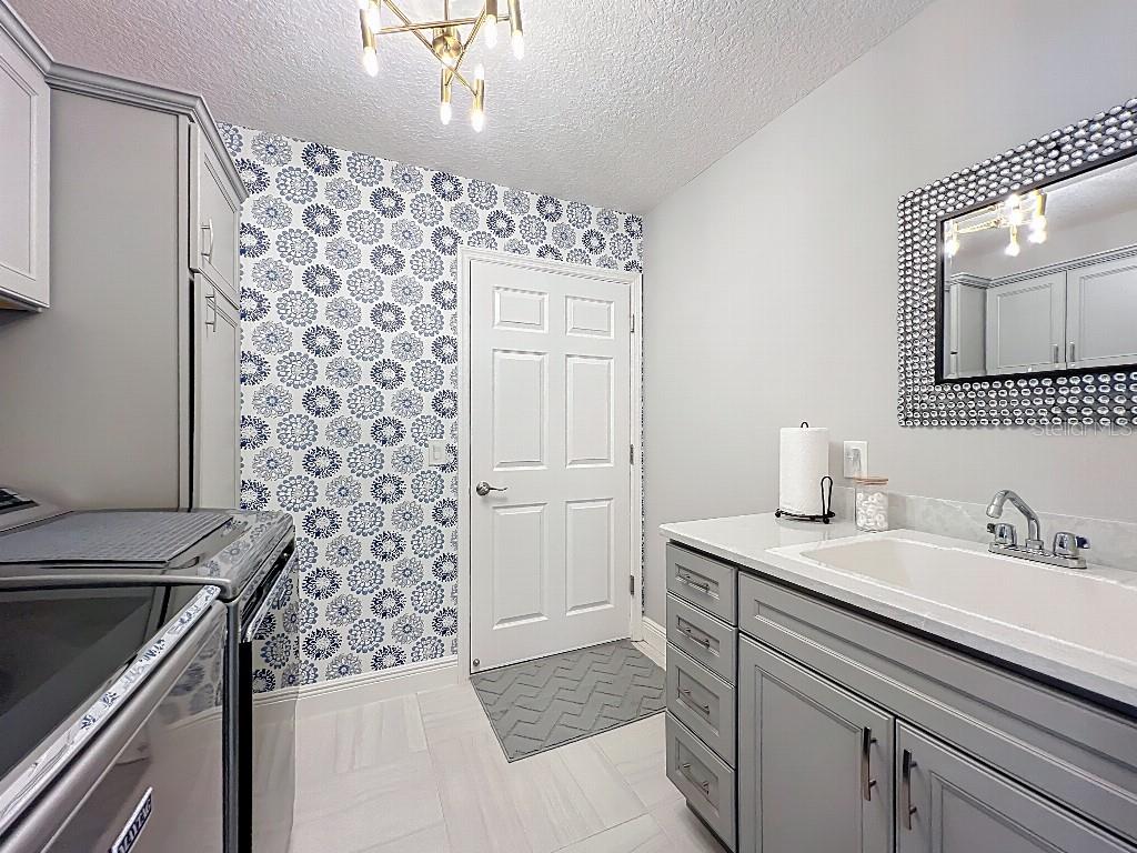 3191 Warbler Loop The Villages, FL 32163 - Photo 36 of 42 a bathroom with a sink a vanity and a mirror
