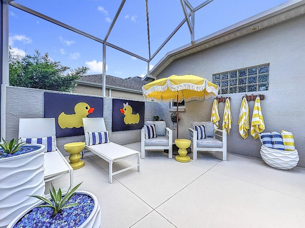3191 Warbler Loop The Villages, FL 32163 - Photo 40 of 42 a living room filled with furniture and a table