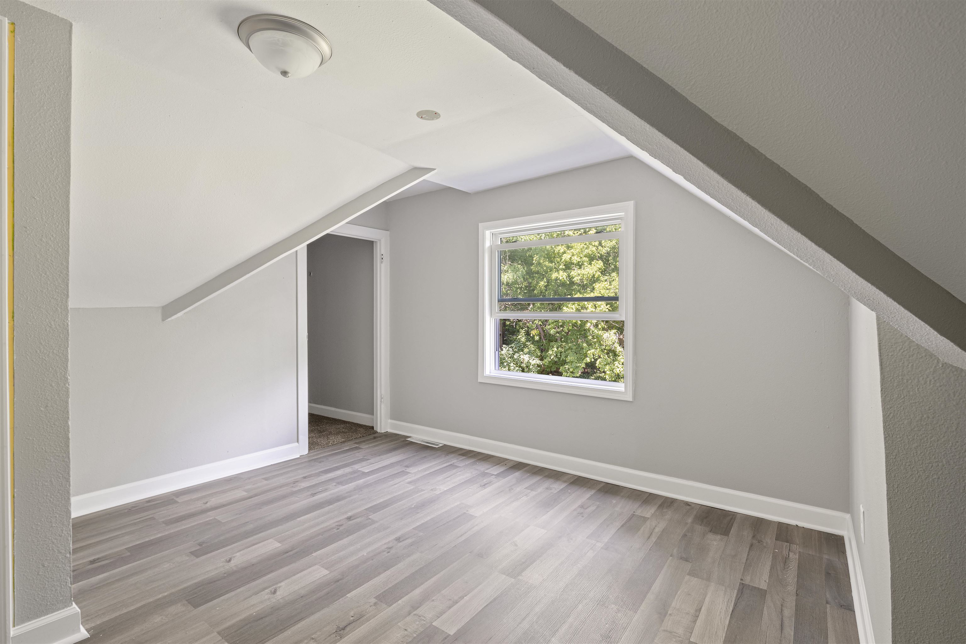 220 South Alpine Road Rockford, IL 61108 - Photo 15 of 18 an empty room with wooden floor and windows