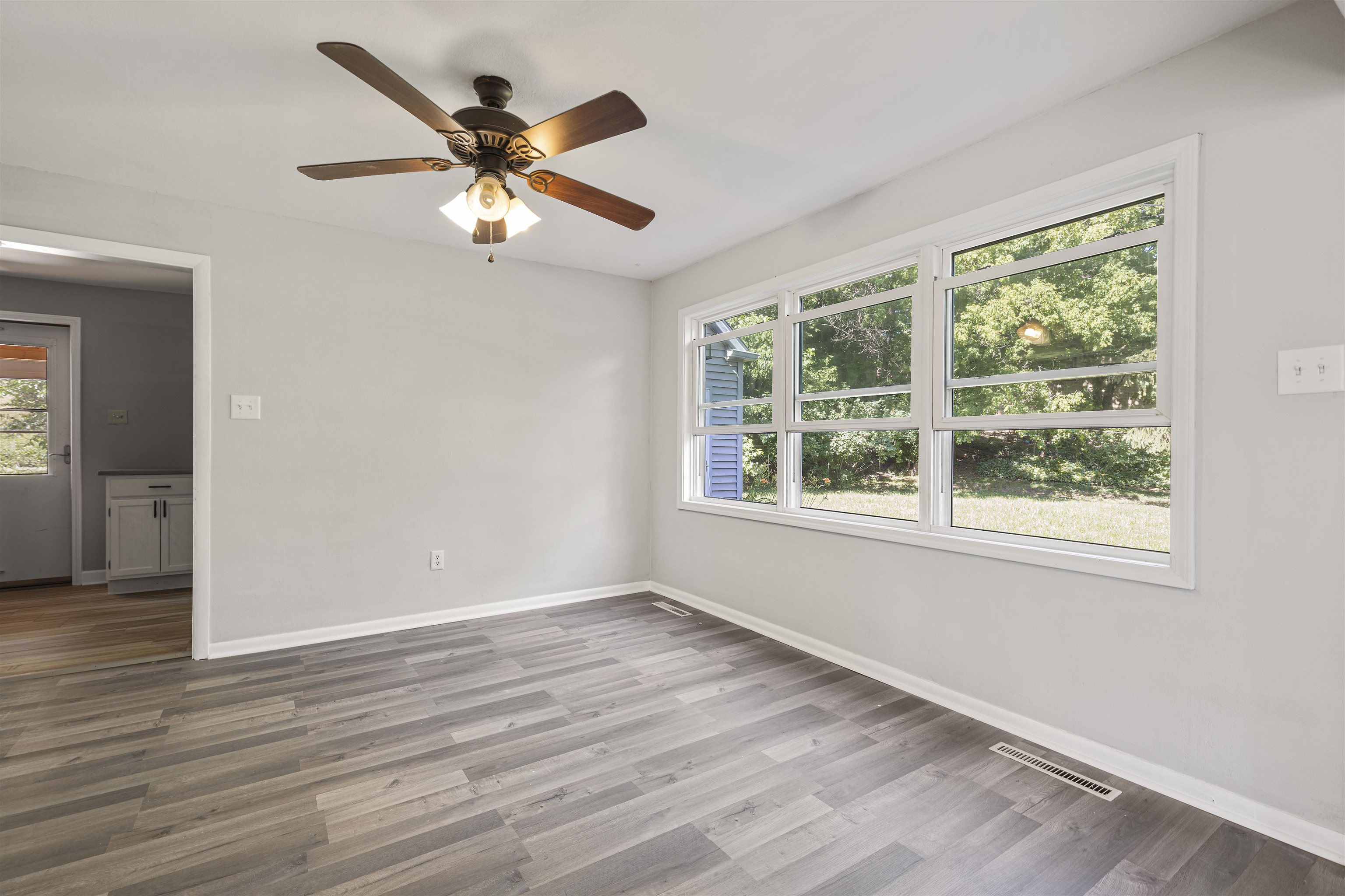 220 South Alpine Road Rockford, IL 61108 - Photo 5 of 18 a view of an empty room with wooden floor and a window