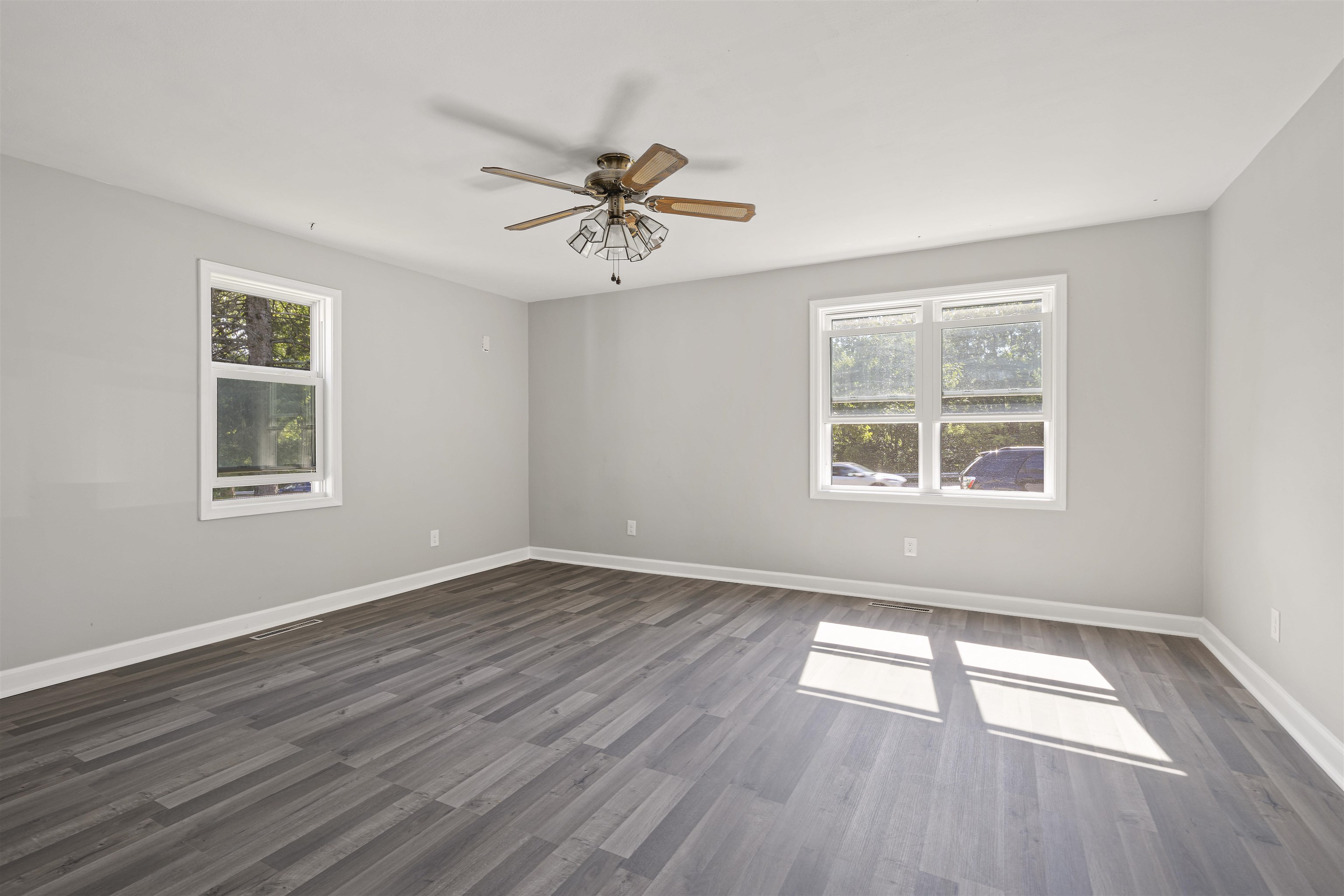 220 South Alpine Road Rockford, IL 61108 - Photo 8 of 18 a view of empty room with wooden floor and fan