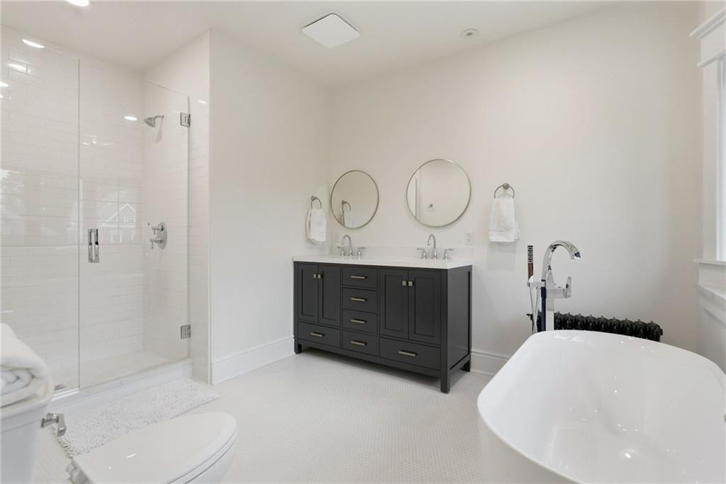 4749 Wallingford Street Pittsburgh, PA 15213 - Photo 31 of 49 a bathroom with a toilet a sink and shower