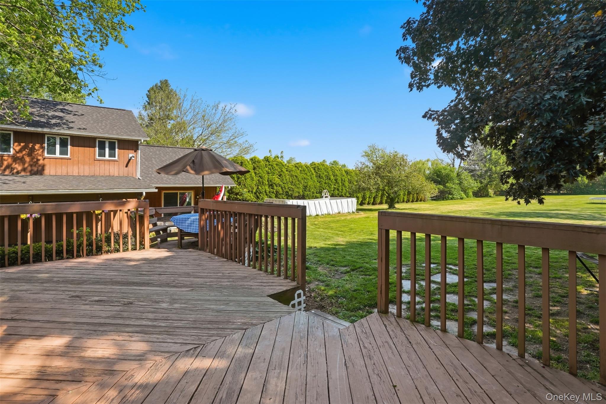 147 County Rte 1 Warwick, NY 10990 - Photo 38 of 45 a balcony with wooden floor and fence