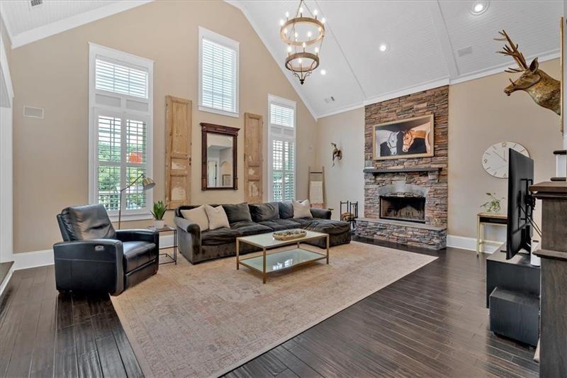 1021 Avery Road Canton, GA 30115 - Photo 11 of 70 a living room with furniture fireplace and flat screen tv