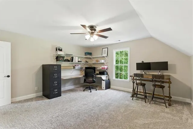 a bathroom with a toilet sink vanity tub and mirror