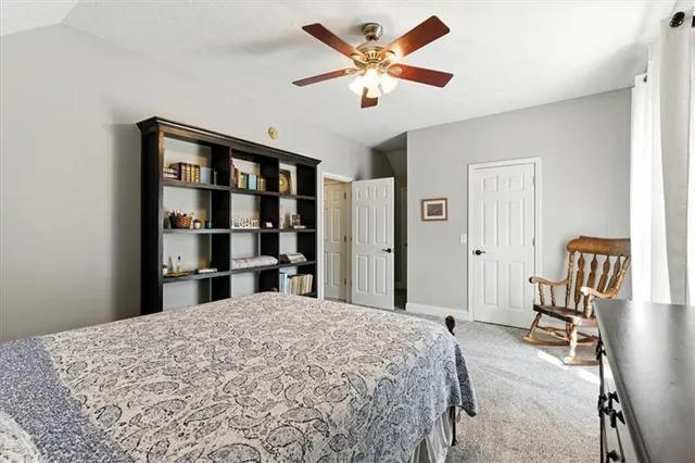 a bathroom with a double vanity sink a toilet and a mirror
