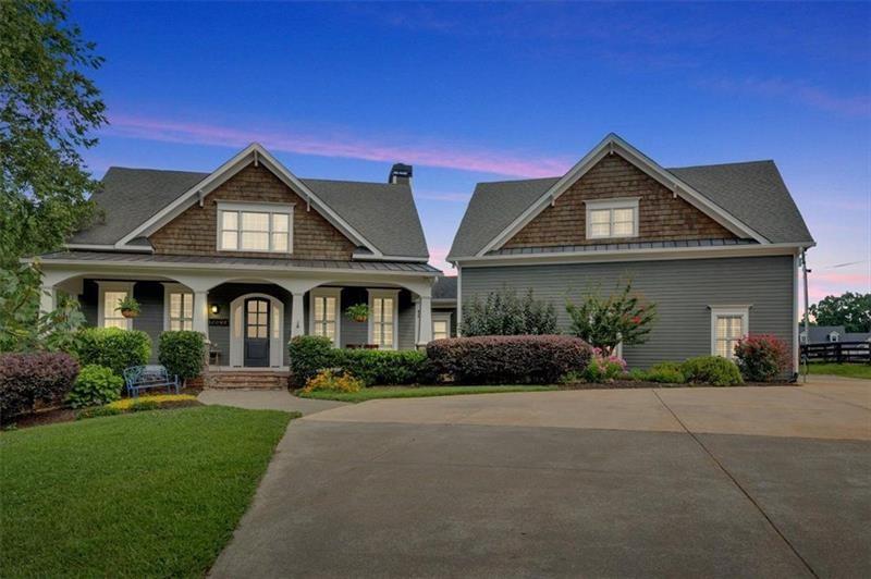 1021 Avery Road Canton, GA 30115 - Photo 4 of 70 a front view of a house with a yard