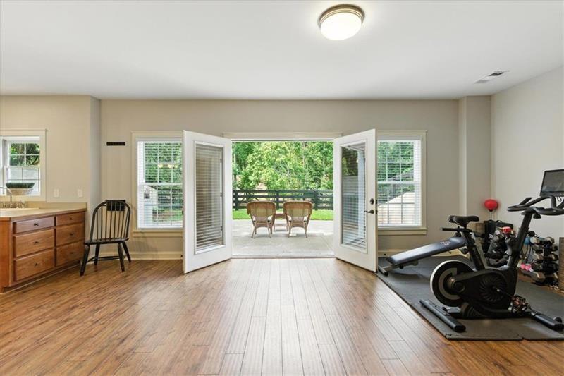 1021 Avery Road Canton, GA 30115 - Photo 42 of 70 a room with furniture and a wooden floor