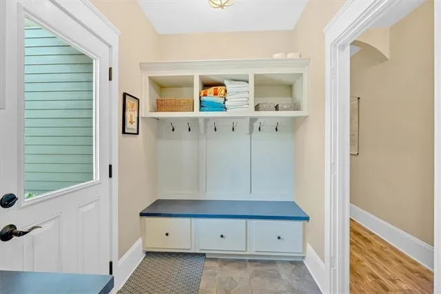 a backyard of a house with table and chairs