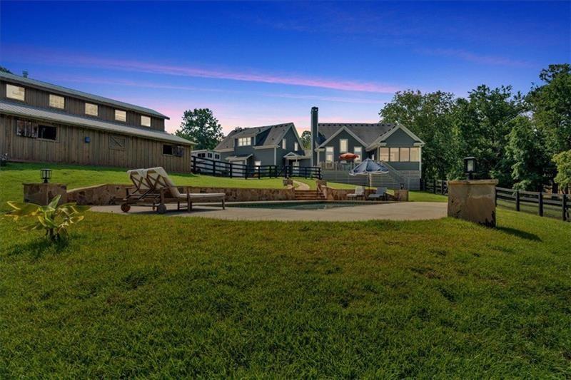 1021 Avery Road Canton, GA 30115 - Photo 53 of 70 a front view of a house with a garden