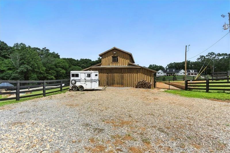 1021 Avery Road Canton, GA 30115 - Photo 55 of 70 a front view of a house with a yard