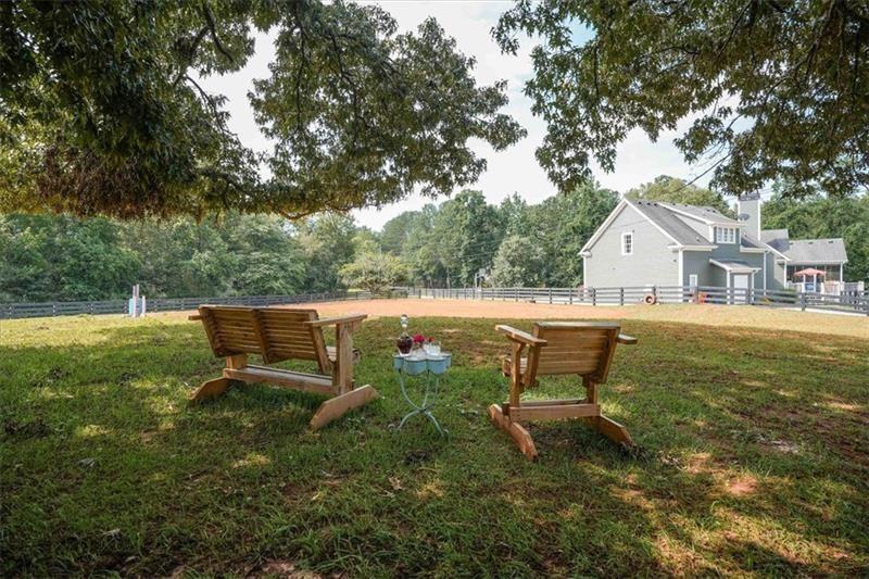 1021 Avery Road Canton, GA 30115 - Photo 64 of 70 a backyard of a house with table and chairs