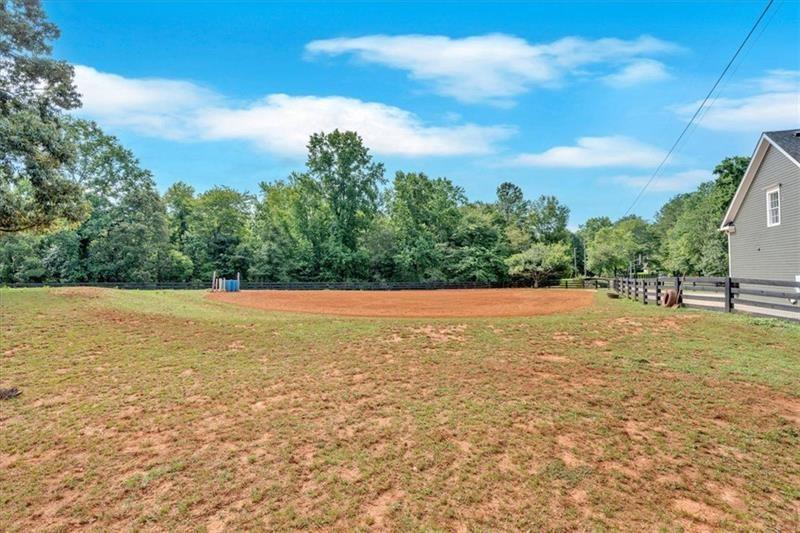 1021 Avery Road Canton, GA 30115 - Photo 65 of 70 a view of a field with large trees