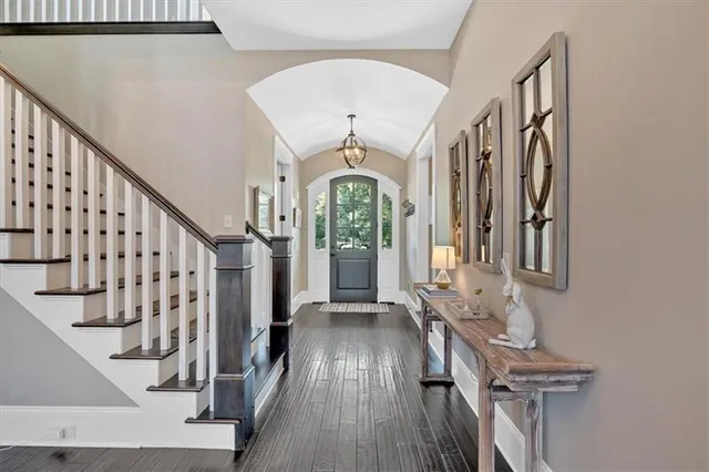 a living room with furniture fireplace and flat screen tv