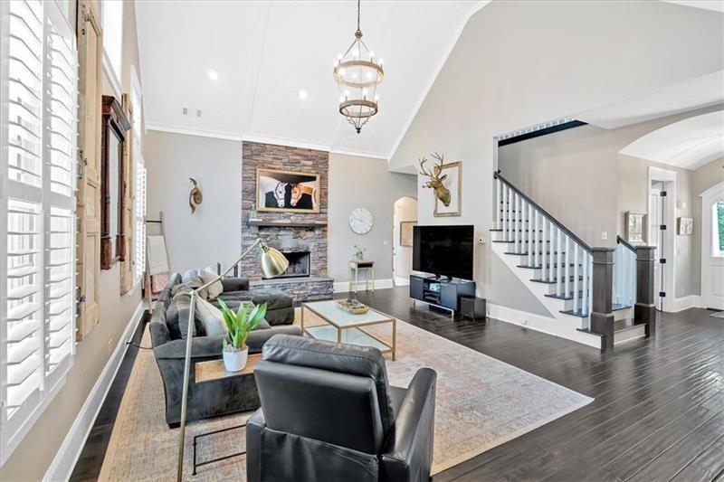 1021 Avery Road Canton, GA 30115 - Photo 9 of 70 a living room with furniture and a fireplace