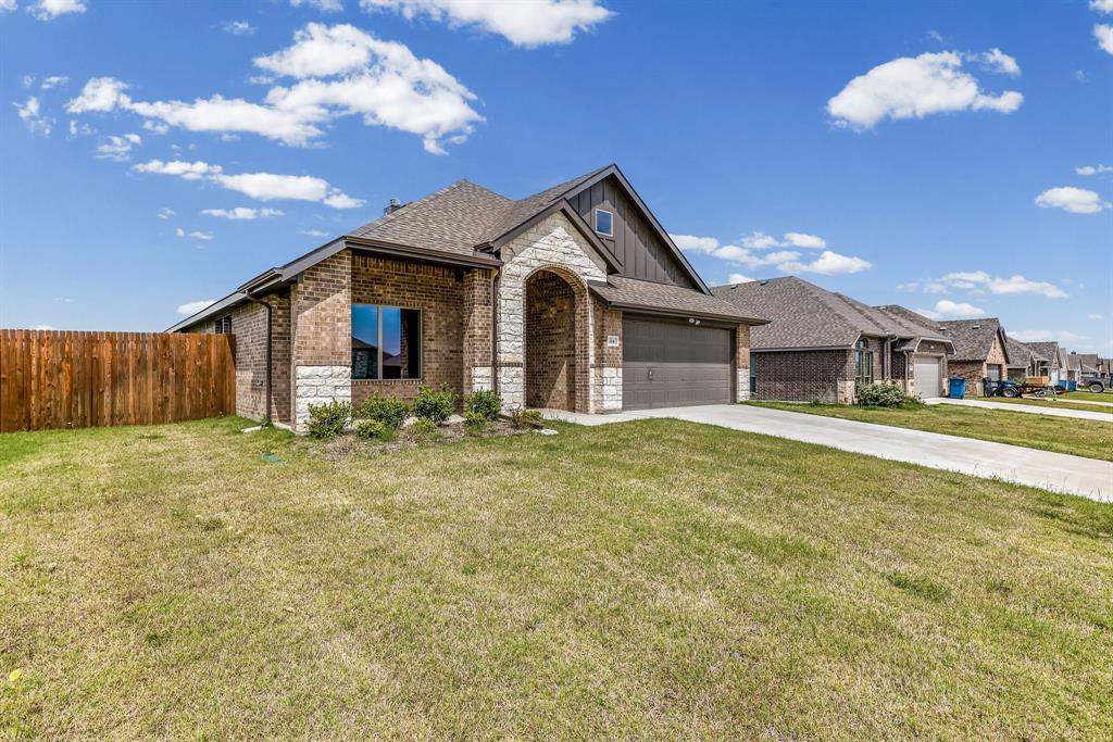 314 Pennington Road Josephine, TX 75173 - Photo 4 of 37 a front view of a house with a garden