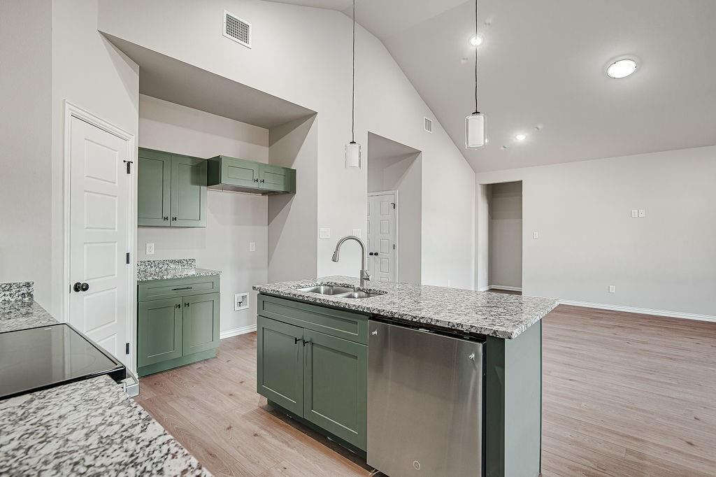 2729 Finley Street Fort Worth, TX 76111 - Photo 16 of 30 a bathroom with a granite countertop sink and a mirror