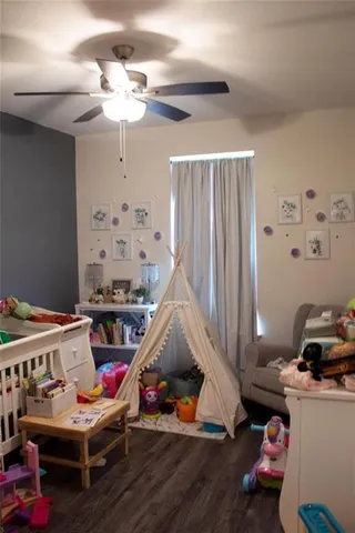 a room with furniture and a wooden floor