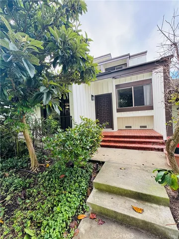 a house with trees in front of it