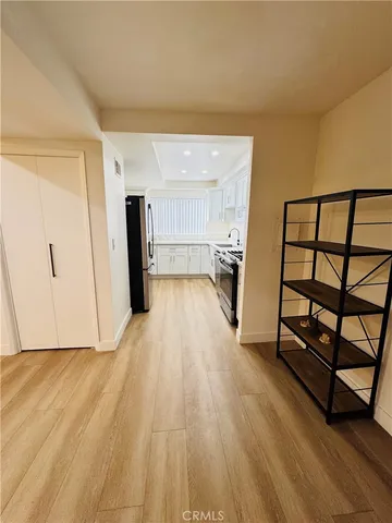 a view of a kitchen with a wooden floor