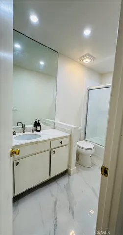 a bathroom with a sink and mirror