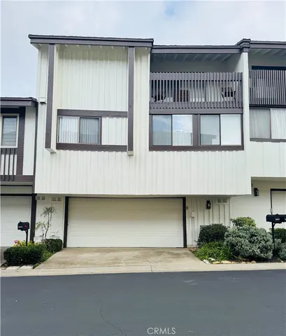 a front view of a house with garage