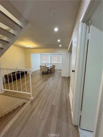 a view of kitchen with furniture and wooden floor