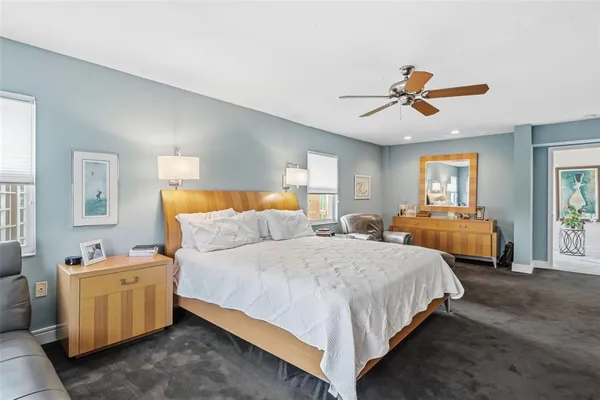 a spacious bathroom with a granite countertop sink mirror and shower