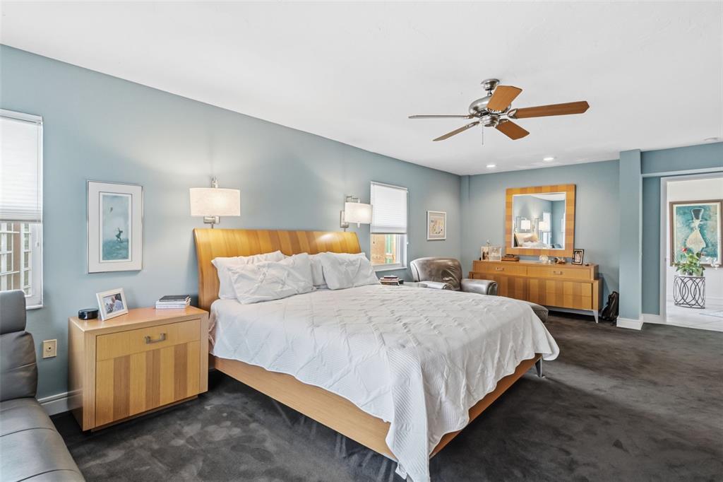 660 Golden Gate Point, Unit 61 Sarasota, FL 34236 - Photo 12 of 44 a bedroom with a bed and window