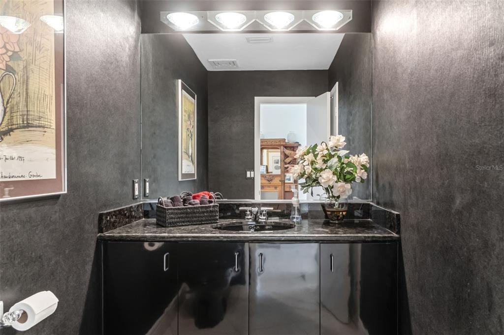 660 Golden Gate Point, Unit 61 Sarasota, FL 34236 - Photo 14 of 44 a bathroom with a sink and a mirror