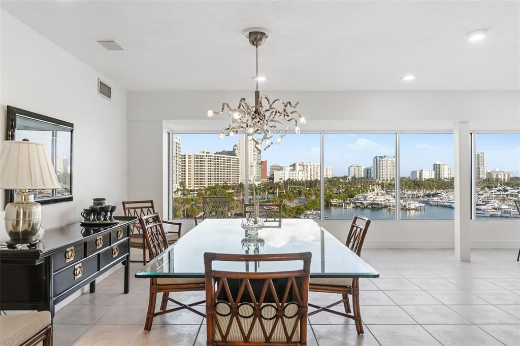 660 Golden Gate Point, Unit 61 Sarasota, FL 34236 - Photo 17 of 44 a view of a dining room with furniture window and outside view