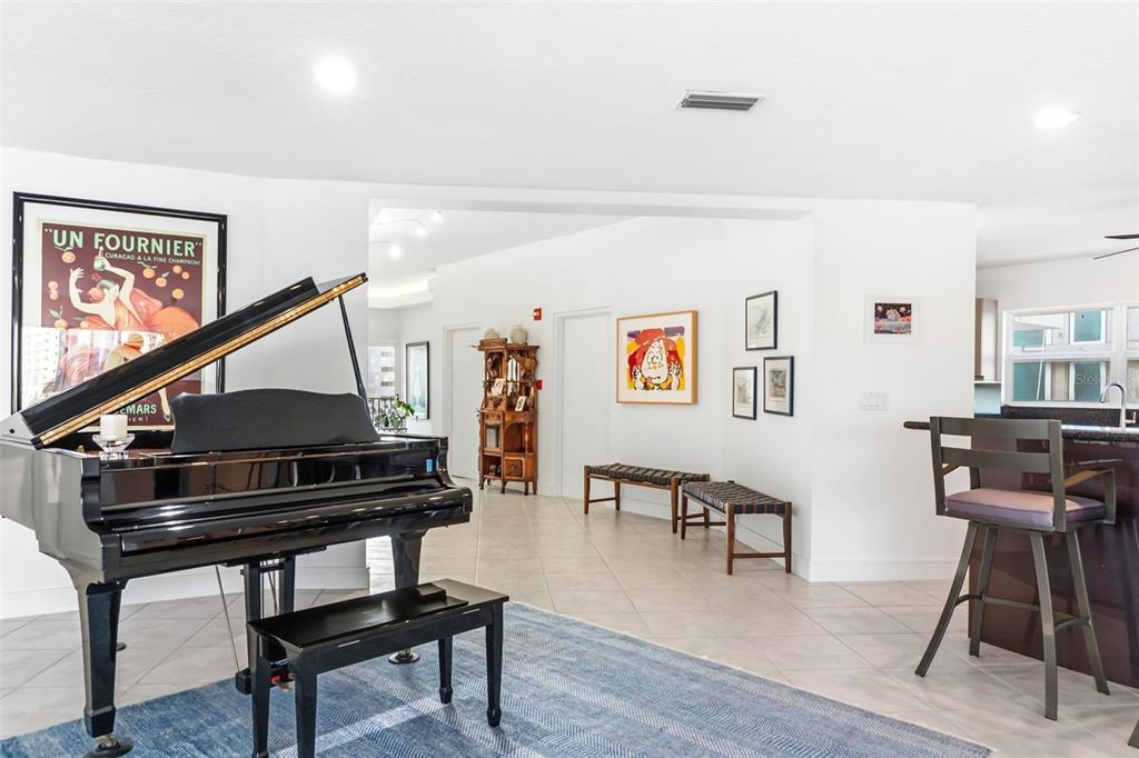 660 Golden Gate Point, Unit 61 Sarasota, FL 34236 - Photo 19 of 44 a living room with furniture and a wooden floor
