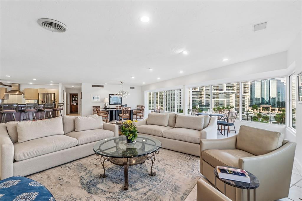 660 Golden Gate Point, Unit 61 Sarasota, FL 34236 - Photo 22 of 44 a living room with furniture and a large window