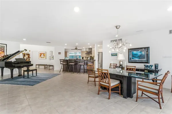 a living room with lots of furniture and chandelier