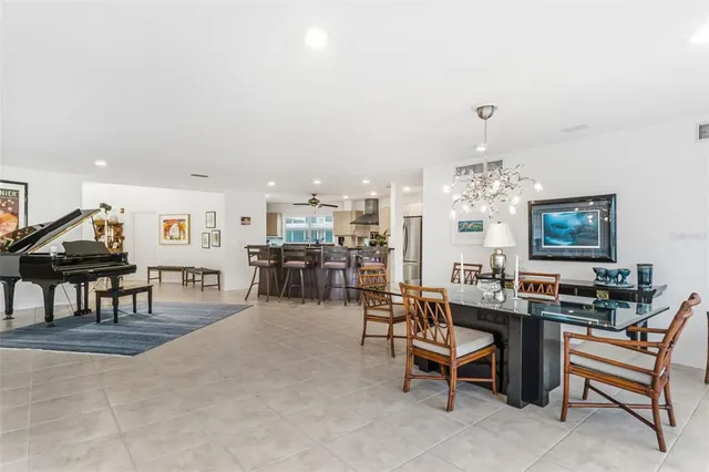 a living room with lots of furniture and chandelier