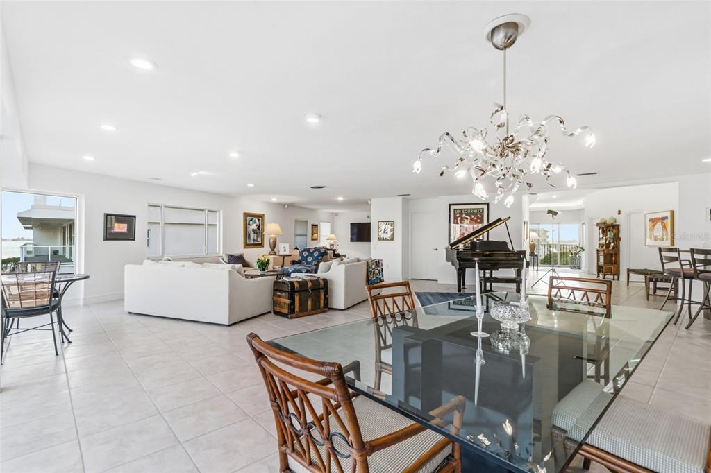 660 Golden Gate Point, Unit 61 Sarasota, FL 34236 - Photo 25 of 44 a living room with lots of furniture and chandelier