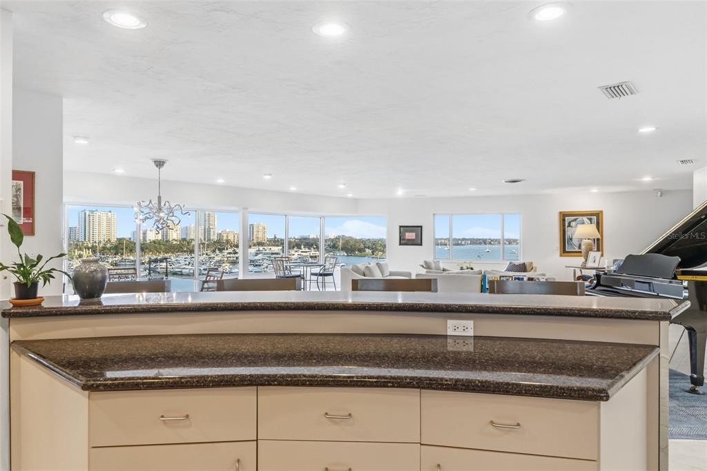 660 Golden Gate Point, Unit 61 Sarasota, FL 34236 - Photo 31 of 44 a kitchen with granite countertop stainless steel appliances a sink and cabinets