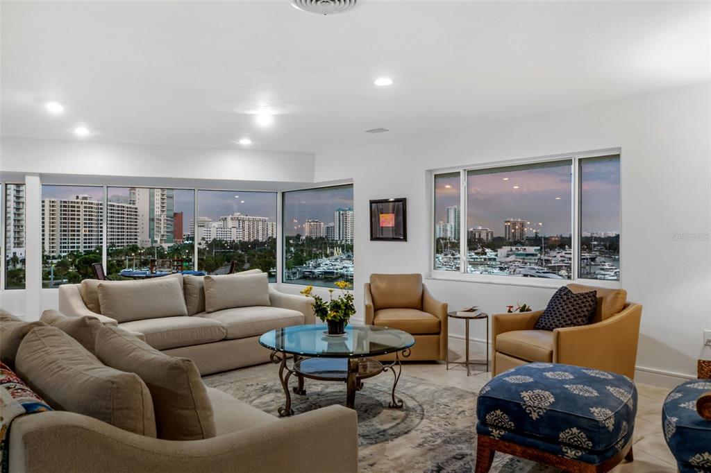 660 Golden Gate Point, Unit 61 Sarasota, FL 34236 - Photo 39 of 44 a living room with furniture and a large window