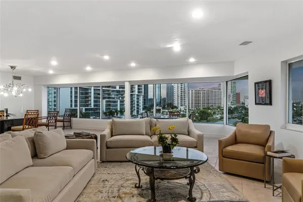 a living room with stainless steel appliances granite countertop furniture and a counter top