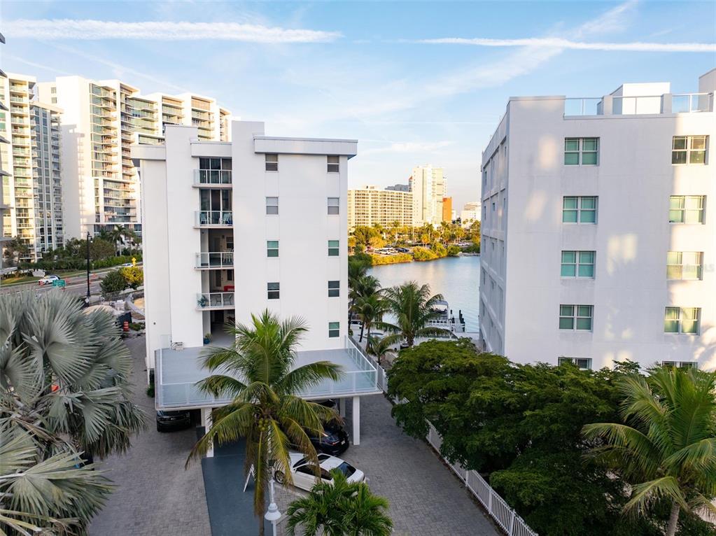 660 Golden Gate Point, Unit 61 Sarasota, FL 34236 - Photo 4 of 44 a view of balcony with potted plants and a building