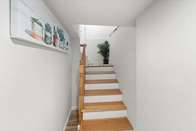 a view of staircase with white walls