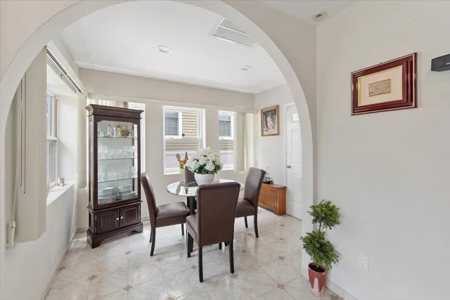 a dining room with furniture and window