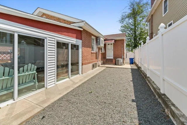 front view of a house with a large window