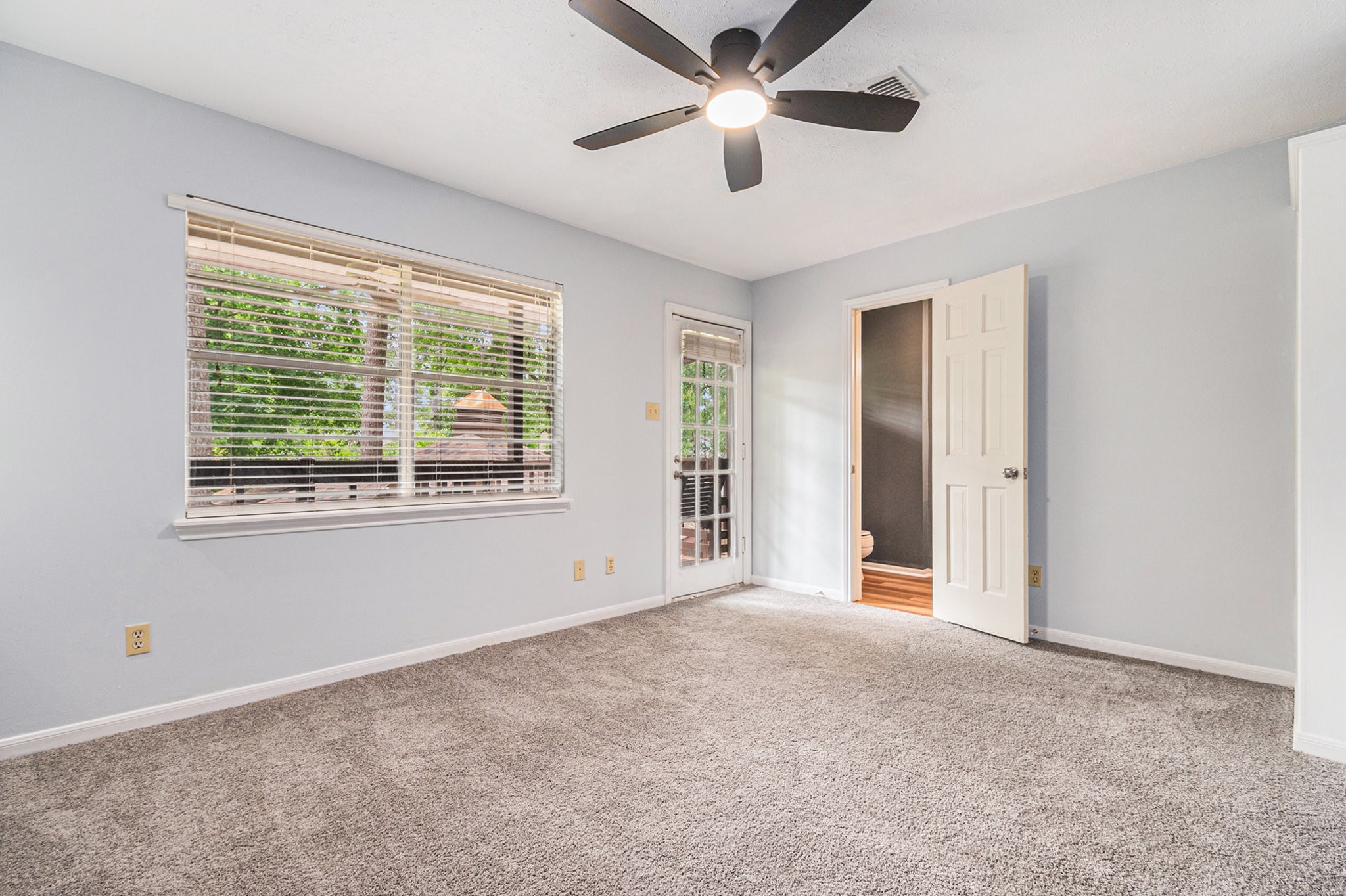 6307 Bayonne Drive Spring, TX 77389 - Photo 34 of 47 an empty room with chandelier fan and windows