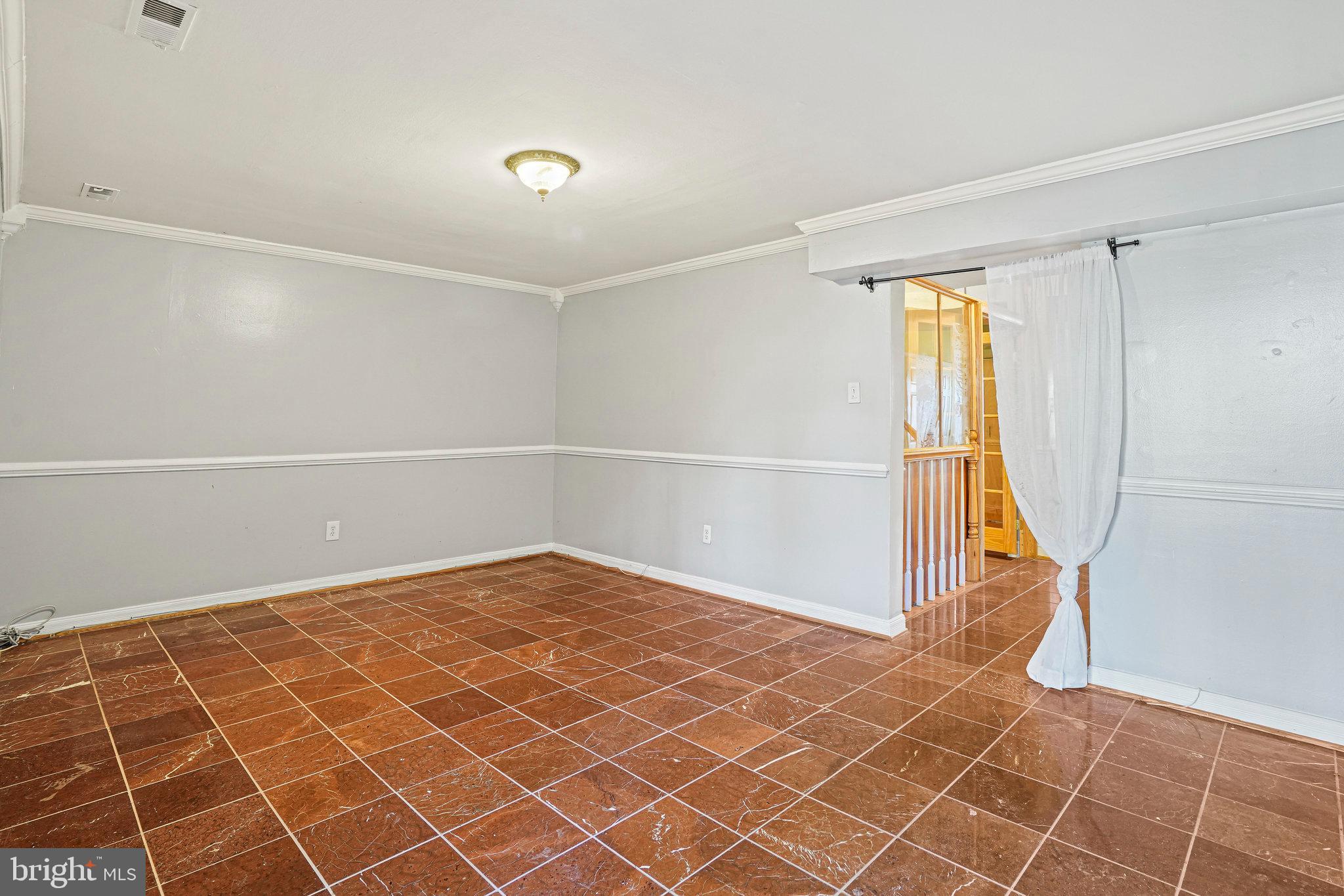 14902 Ashford Place Laurel, MD 20707 - Photo 12 of 41 a view of an empty room with a window