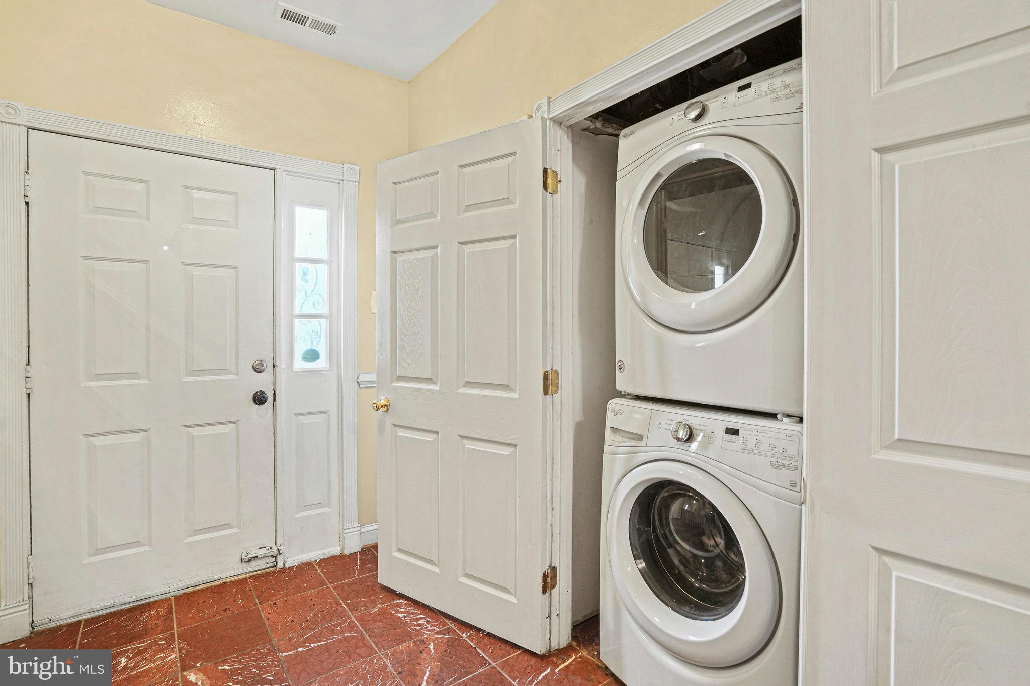 14902 Ashford Place Laurel, MD 20707 - Photo 8 of 41 a view of a hallway with washer and dryer