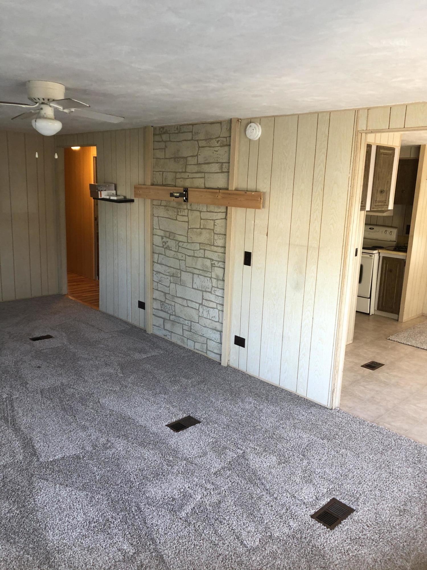 401 Hawk Drive Sebastian, FL 32976 - Photo 2 of 23 a view of a hallway with wooden shelves